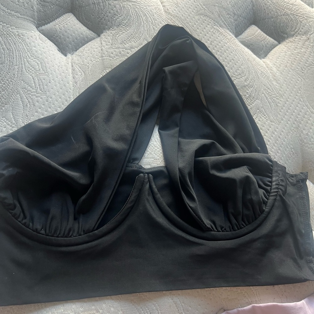 Black halter top with criss cross backing. From Akira. Size 4 never worn.